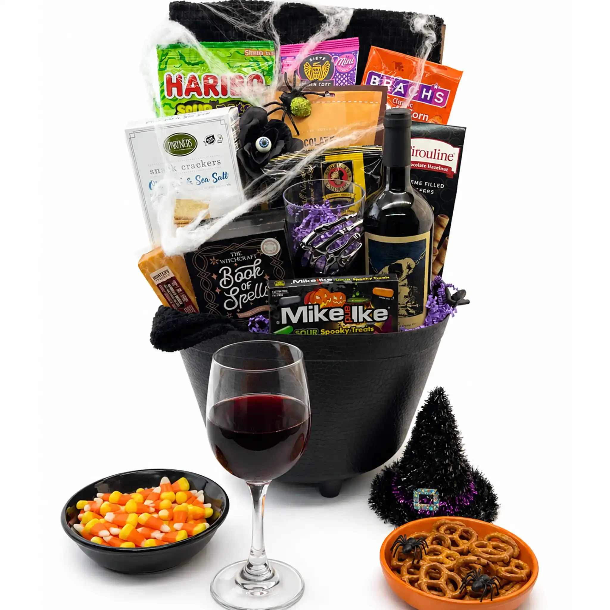 Witches Brew Halloween basket in a keepsake cauldron with wine, gourmet snacks, and seasonal candy